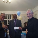 Colin Presents Cheque to Friend in Need